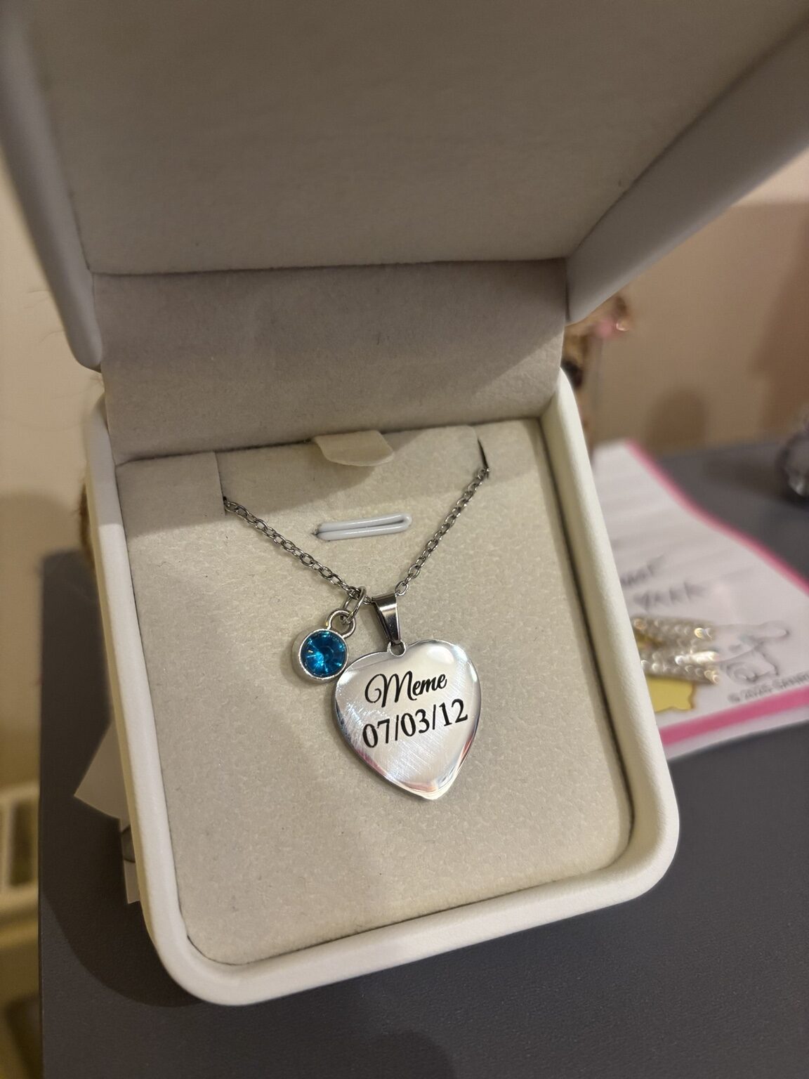 Personalised heart necklace engraved with a name and date