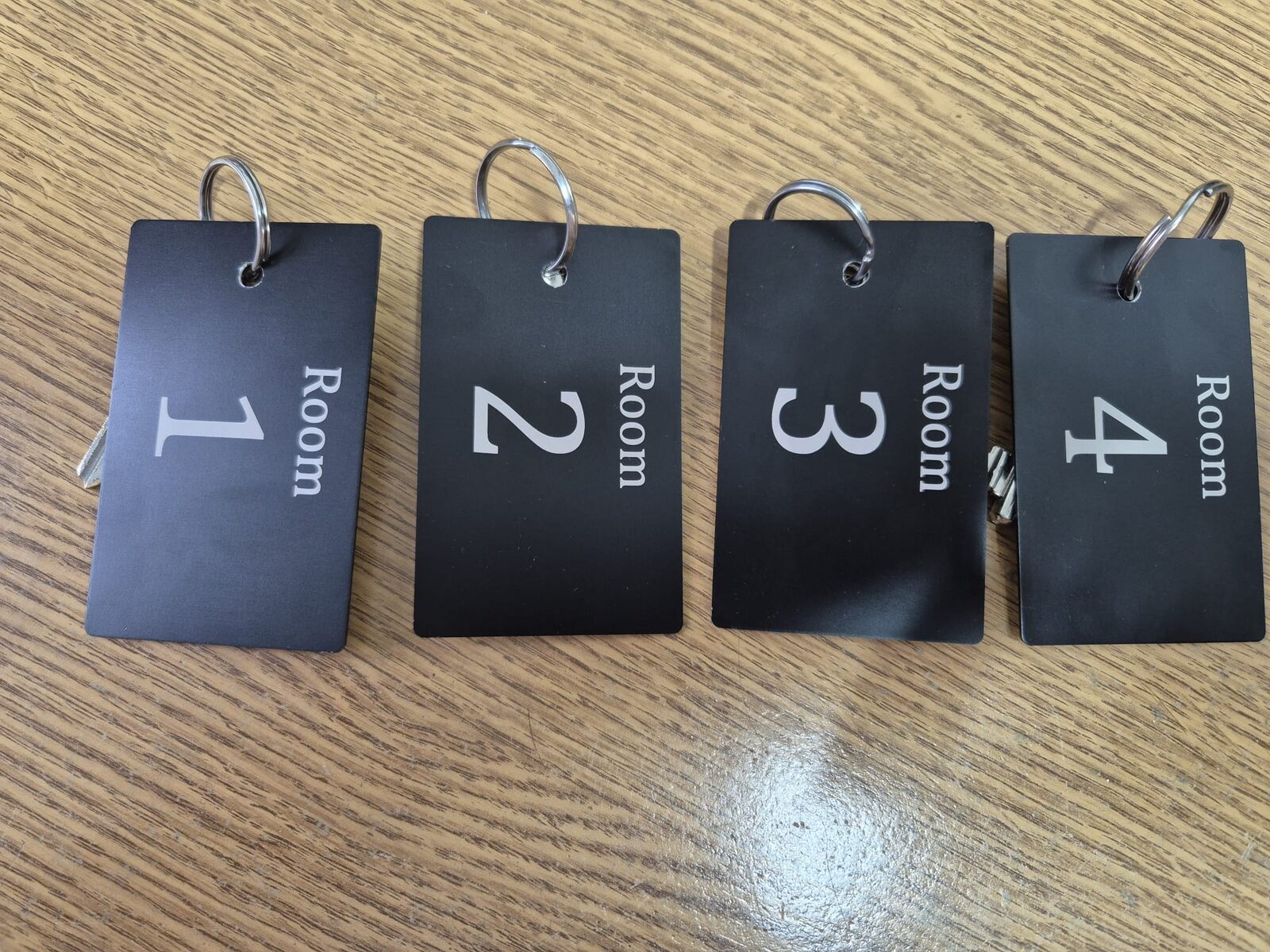 Finished engraved room key cards for The Live and Let Live